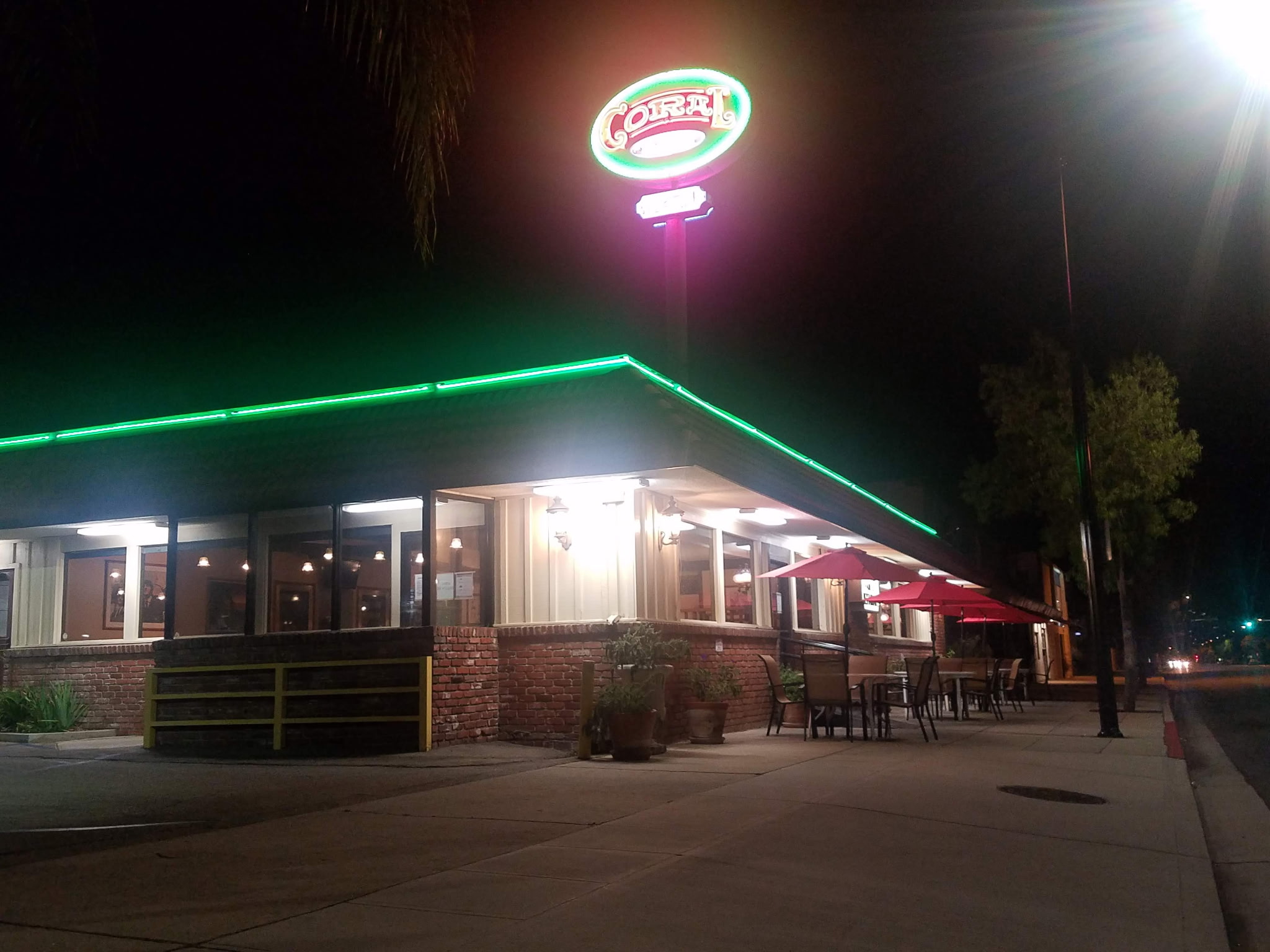 Coral Cafe at night — green neon roofline over Burbank Blvd.